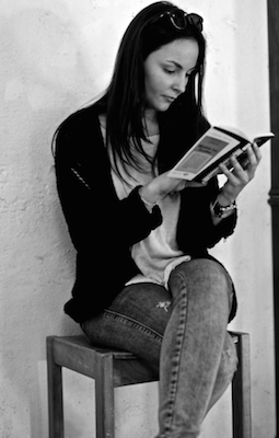 Image of a woman reading a book
