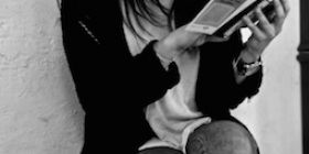 Image of a woman reading a book