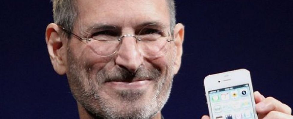 Steve Jobs holding an iPhone